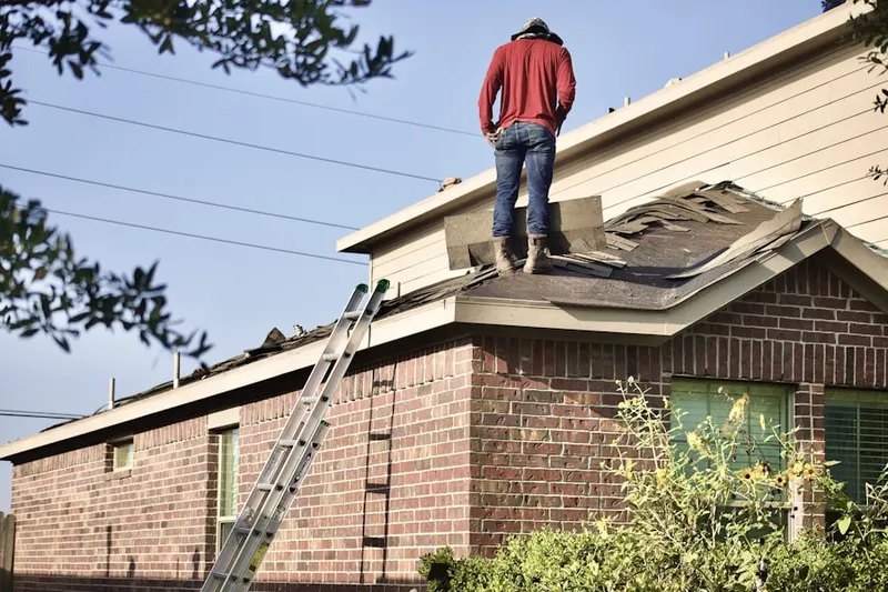 Professional roofer working on a residential roof in Windmill Ranch Estates